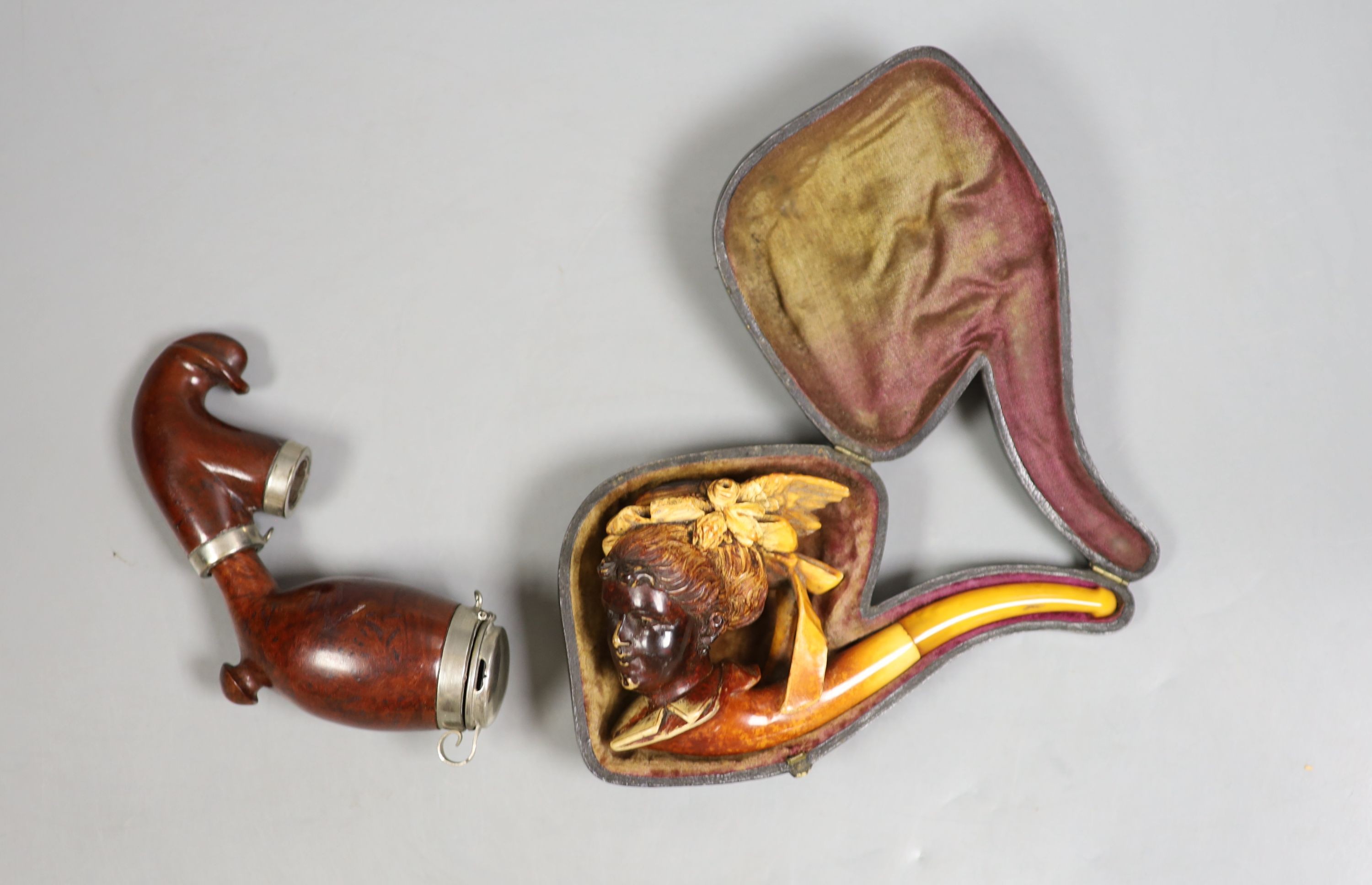 A Victorian Meerschaum pipe modelled as a lady, 13.5cm long, cased, and a Briar pipe